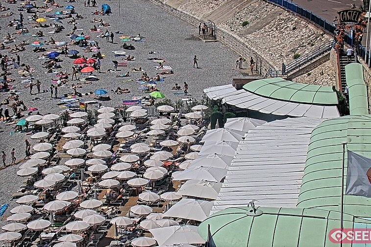Webcam view of the Castel beach and club on the eastern-most side of the Promenade des Anglais and nestled under the Parc du Chateau, in Nice, France