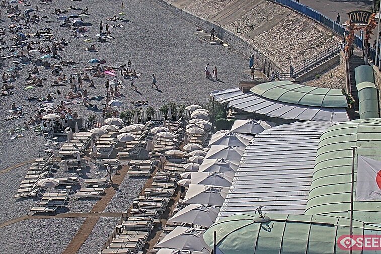 Webcam view of the Castel beach and club on the eastern-most side of the Promenade des Anglais and nestled under the Parc du Chateau, in Nice, France