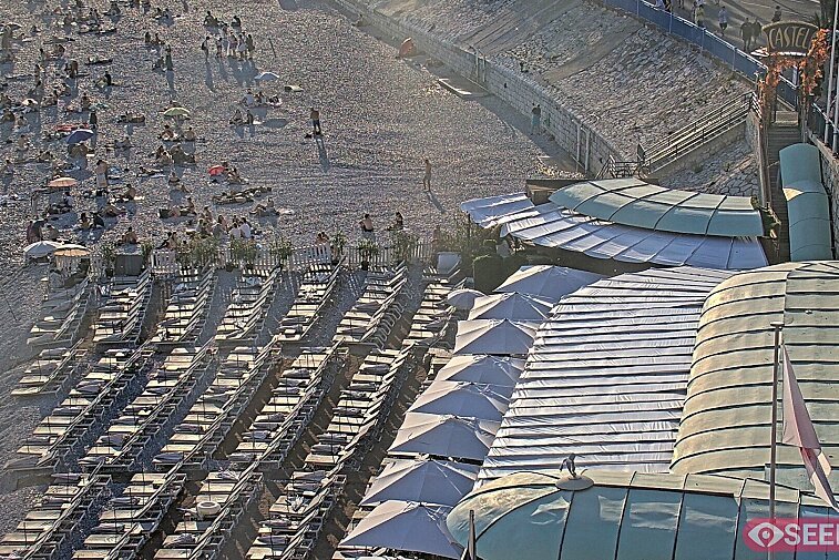 Webcam view of the Castel beach and club on the eastern-most side of the Promenade des Anglais and nestled under the Parc du Chateau, in Nice, France