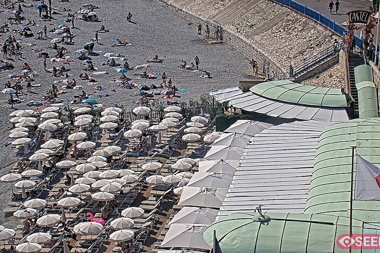 Webcam view of the Castel beach and club on the eastern-most side of the Promenade des Anglais and nestled under the Parc du Chateau, in Nice, France