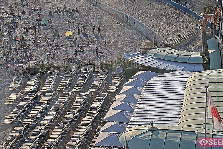 Webcam view of the Castel beach and club on the eastern-most side of the Promenade des Anglais and nestled under the Parc du Chateau, in Nice, France