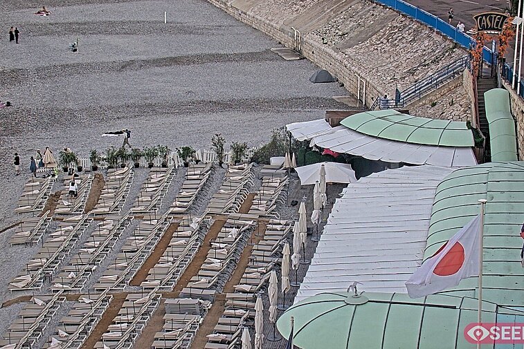 Webcam view of the Castel beach and club on the eastern-most side of the Promenade des Anglais and nestled under the Parc du Chateau, in Nice, France