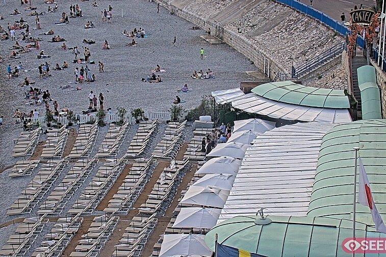 Webcam view of the Castel beach and club on the eastern-most side of the Promenade des Anglais and nestled under the Parc du Chateau, in Nice, France