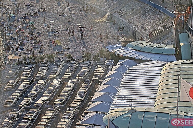 Webcam view of the Castel beach and club on the eastern-most side of the Promenade des Anglais and nestled under the Parc du Chateau, in Nice, France