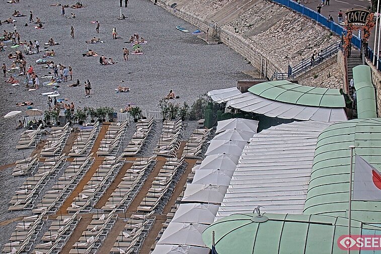 Webcam view of the Castel beach and club on the eastern-most side of the Promenade des Anglais and nestled under the Parc du Chateau, in Nice, France