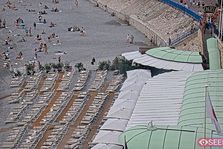 Webcam view of the Castel beach and club on the eastern-most side of the Promenade des Anglais and nestled under the Parc du Chateau, in Nice, France