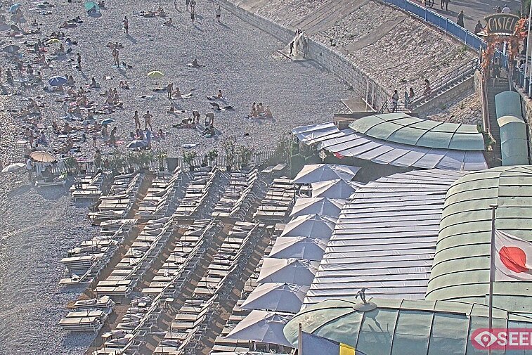 Webcam view of the Castel beach and club on the eastern-most side of the Promenade des Anglais and nestled under the Parc du Chateau, in Nice, France
