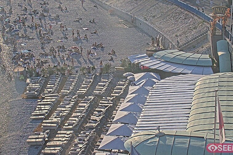 Webcam view of the Castel beach and club on the eastern-most side of the Promenade des Anglais and nestled under the Parc du Chateau, in Nice, France