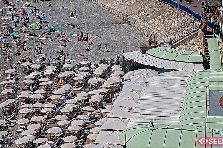 Webcam view of the Castel beach and club on the eastern-most side of the Promenade des Anglais and nestled under the Parc du Chateau, in Nice, France