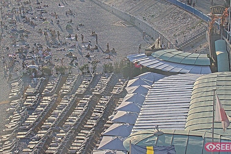 Webcam view of the Castel beach and club on the eastern-most side of the Promenade des Anglais and nestled under the Parc du Chateau, in Nice, France