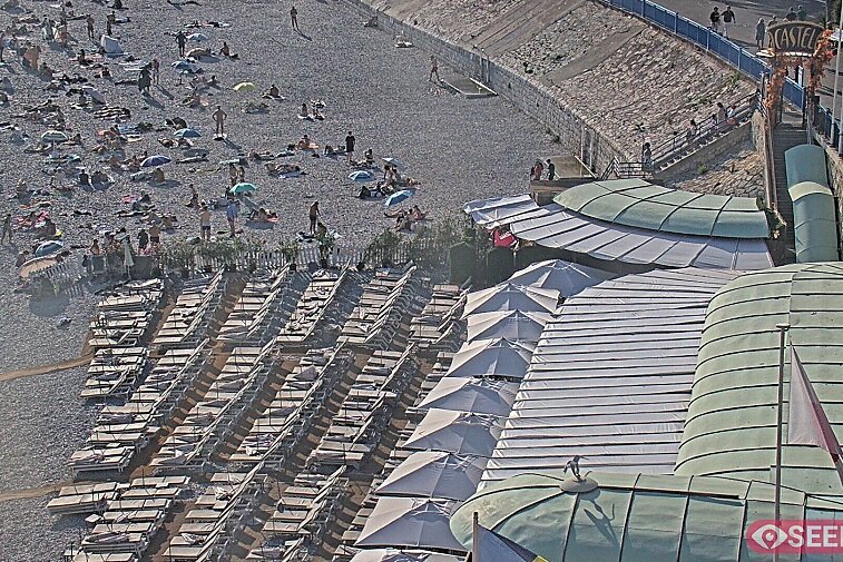 Webcam view of the Castel beach and club on the eastern-most side of the Promenade des Anglais and nestled under the Parc du Chateau, in Nice, France