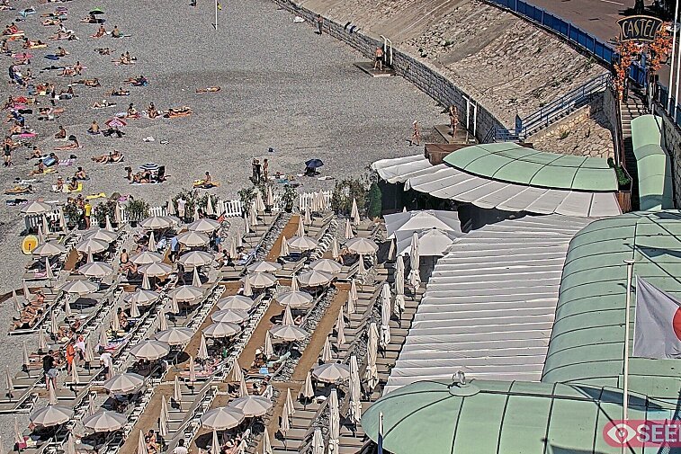 Webcam view of the Castel beach and club on the eastern-most side of the Promenade des Anglais and nestled under the Parc du Chateau, in Nice, France