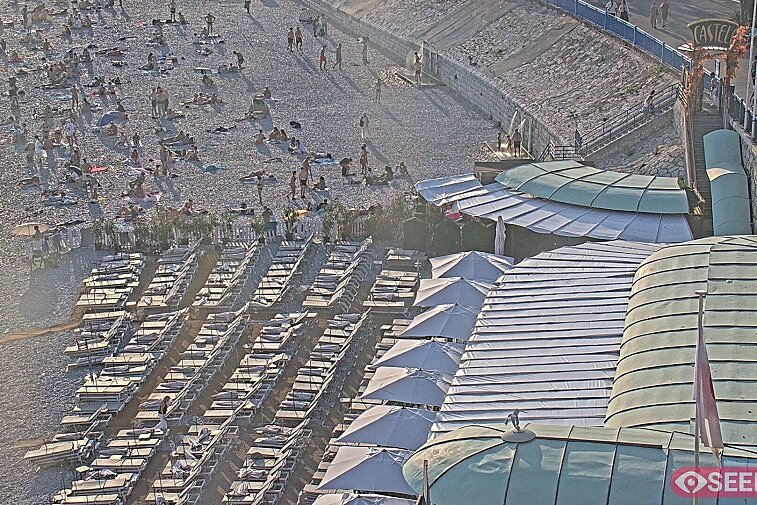 Webcam view of the Castel beach and club on the eastern-most side of the Promenade des Anglais and nestled under the Parc du Chateau, in Nice, France