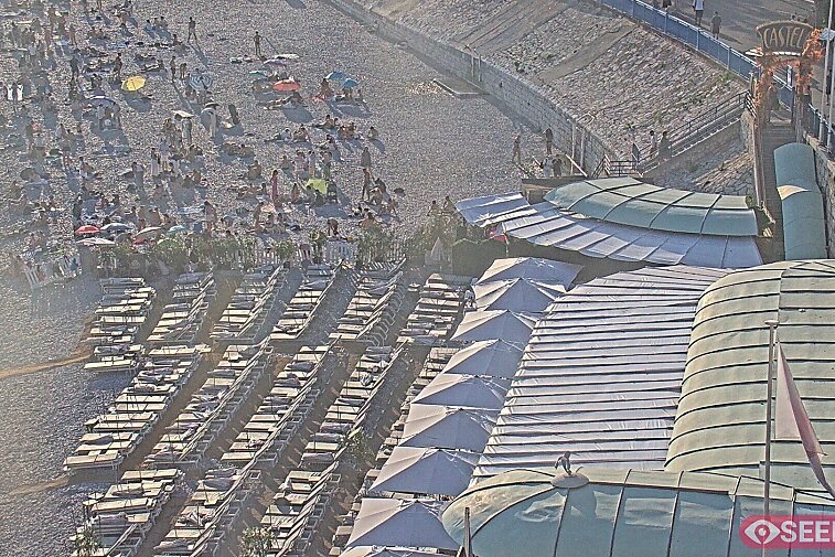 Webcam view of the Castel beach and club on the eastern-most side of the Promenade des Anglais and nestled under the Parc du Chateau, in Nice, France