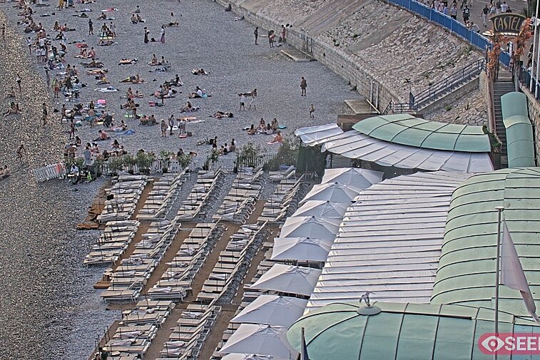 Webcam view of the Castel beach and club on the eastern-most side of the Promenade des Anglais and nestled under the Parc du Chateau, in Nice, France