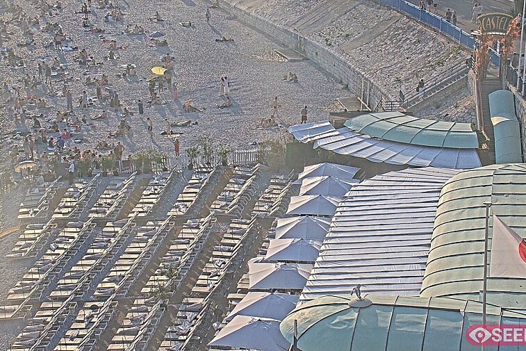 Webcam view of the Castel beach and club on the eastern-most side of the Promenade des Anglais and nestled under the Parc du Chateau, in Nice, France