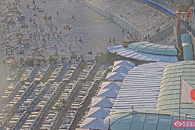 Webcam view of the Castel beach and club on the eastern-most side of the Promenade des Anglais and nestled under the Parc du Chateau, in Nice, France