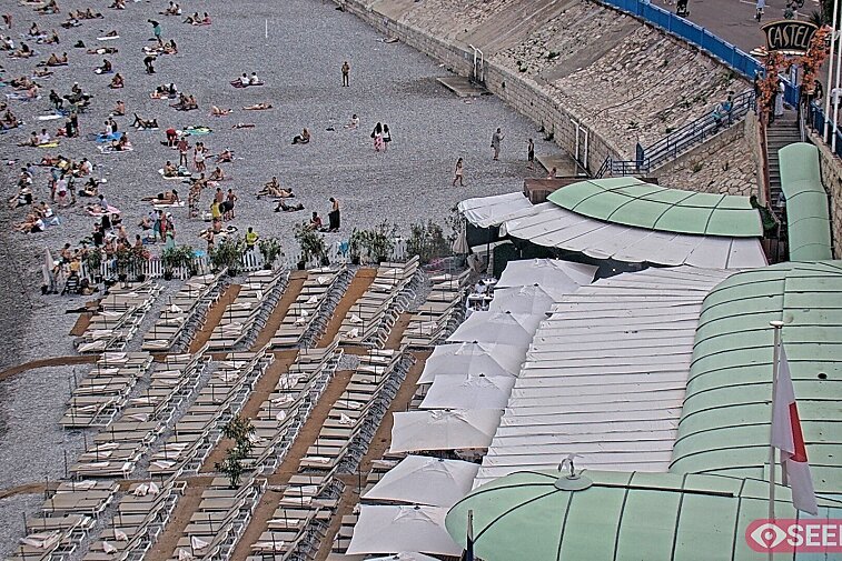 Webcam view of the Castel beach and club on the eastern-most side of the Promenade des Anglais and nestled under the Parc du Chateau, in Nice, France