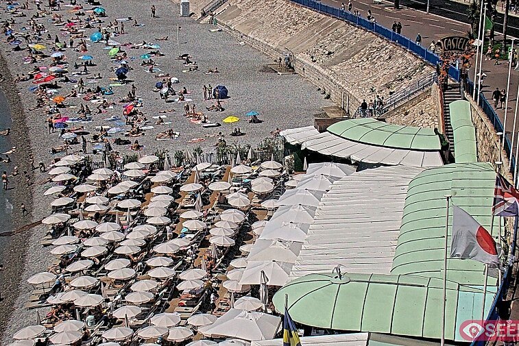 Webcam view of the Castel beach and club on the eastern-most side of the Promenade des Anglais and nestled under the Parc du Chateau, in Nice, France