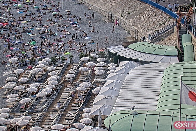 Webcam view of the Castel beach and club on the eastern-most side of the Promenade des Anglais and nestled under the Parc du Chateau, in Nice, France