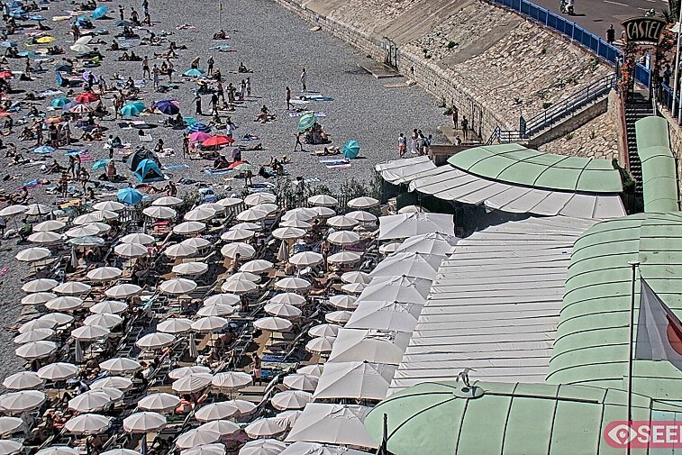 Webcam view of the Castel beach and club on the eastern-most side of the Promenade des Anglais and nestled under the Parc du Chateau, in Nice, France