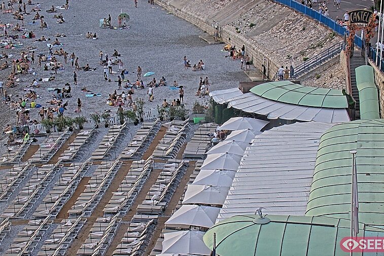 Webcam view of the Castel beach and club on the eastern-most side of the Promenade des Anglais and nestled under the Parc du Chateau, in Nice, France