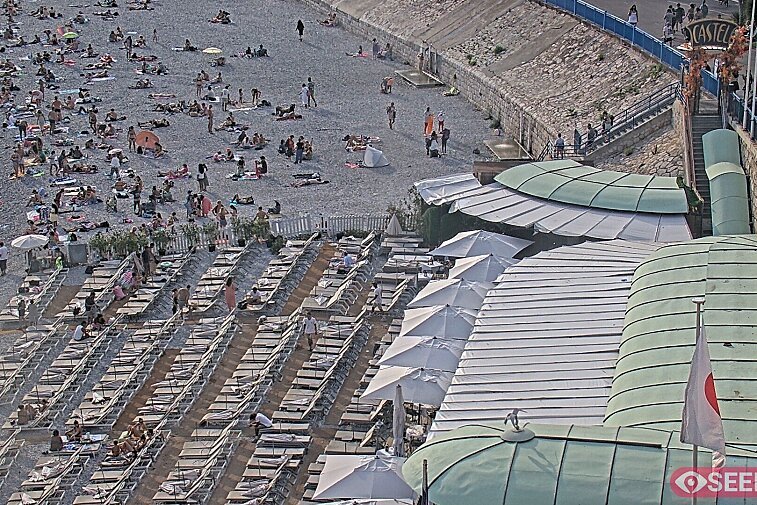 Webcam view of the Castel beach and club on the eastern-most side of the Promenade des Anglais and nestled under the Parc du Chateau, in Nice, France