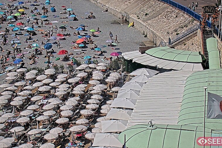 Webcam view of the Castel beach and club on the eastern-most side of the Promenade des Anglais and nestled under the Parc du Chateau, in Nice, France