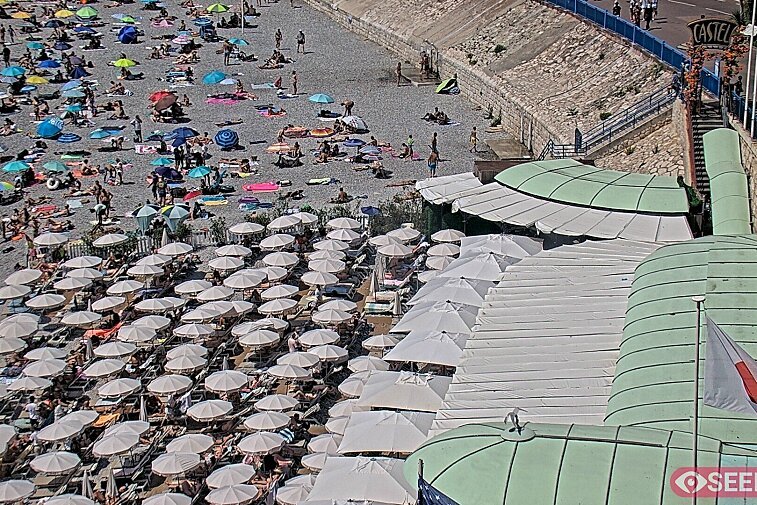 Webcam view of the Castel beach and club on the eastern-most side of the Promenade des Anglais and nestled under the Parc du Chateau, in Nice, France