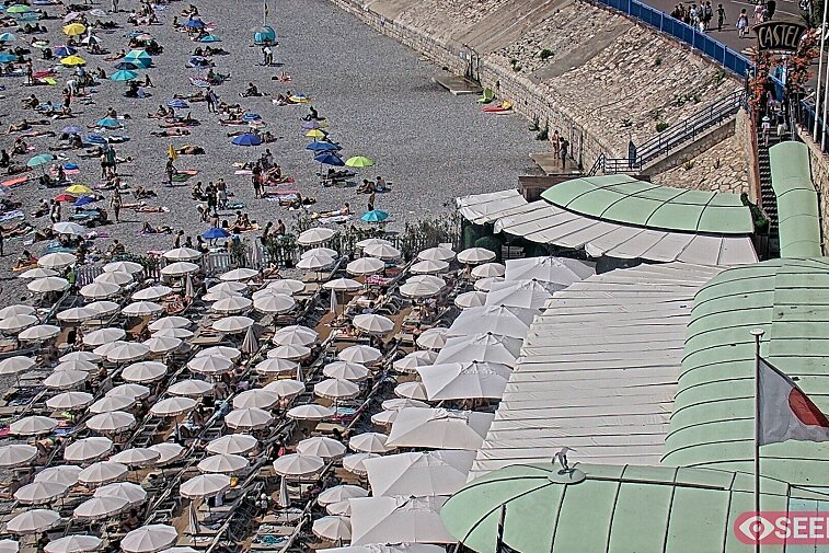 Webcam view of the Castel beach and club on the eastern-most side of the Promenade des Anglais and nestled under the Parc du Chateau, in Nice, France