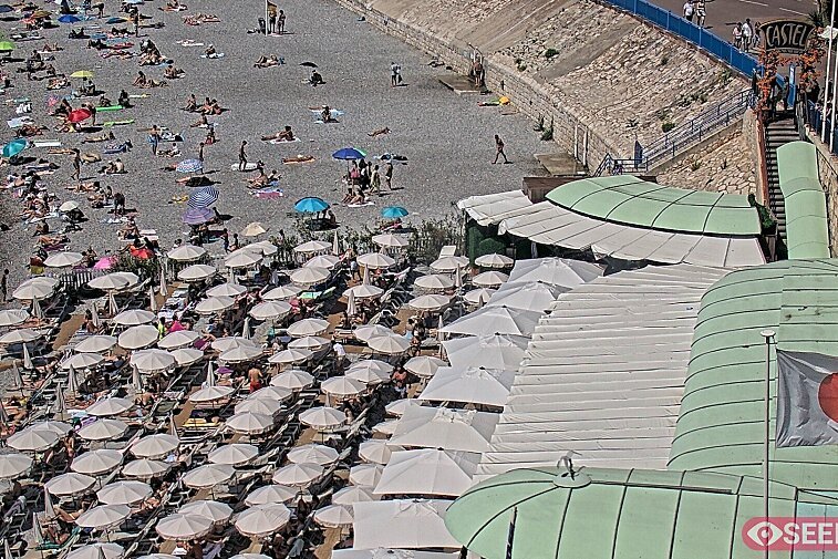 Webcam view of the Castel beach and club on the eastern-most side of the Promenade des Anglais and nestled under the Parc du Chateau, in Nice, France