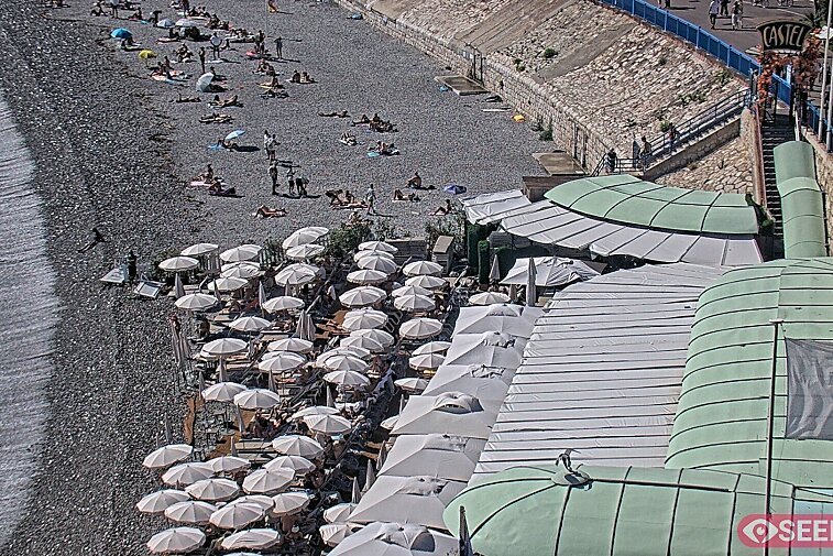 Webcam view of the Castel beach and club on the eastern-most side of the Promenade des Anglais and nestled under the Parc du Chateau, in Nice, France
