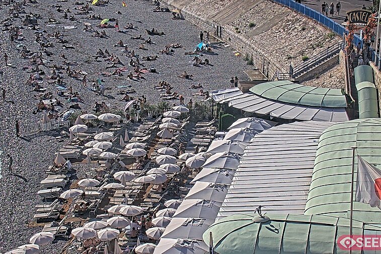 Webcam view of the Castel beach and club on the eastern-most side of the Promenade des Anglais and nestled under the Parc du Chateau, in Nice, France