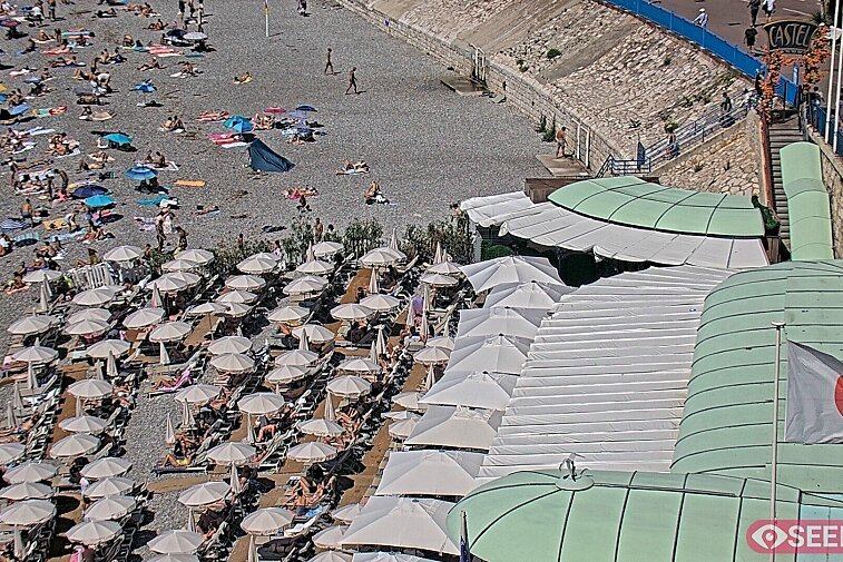 Webcam view of the Castel beach and club on the eastern-most side of the Promenade des Anglais and nestled under the Parc du Chateau, in Nice, France