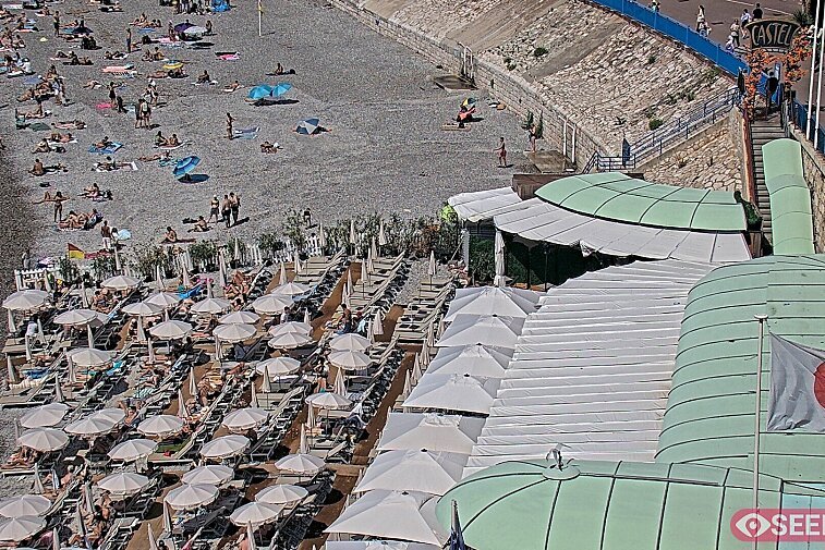 Webcam view of the Castel beach and club on the eastern-most side of the Promenade des Anglais and nestled under the Parc du Chateau, in Nice, France