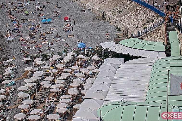 Webcam view of the Castel beach and club on the eastern-most side of the Promenade des Anglais and nestled under the Parc du Chateau, in Nice, France