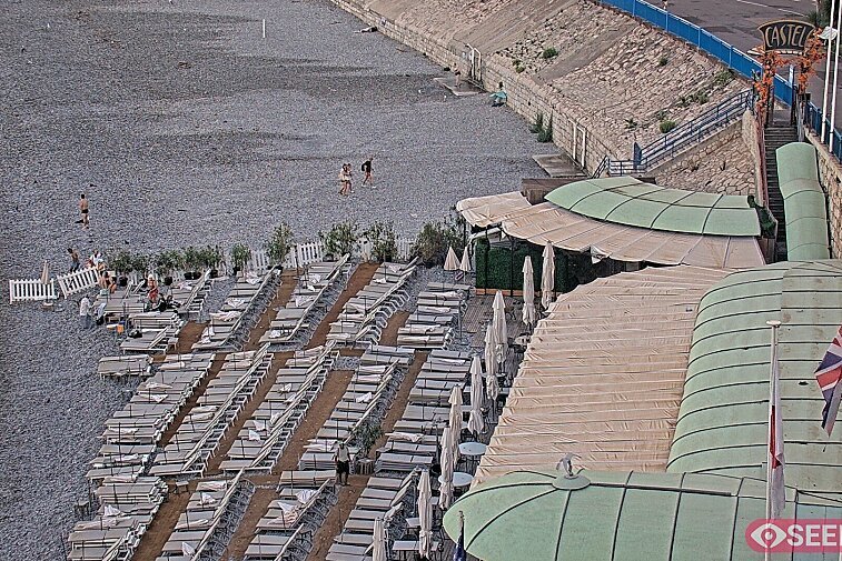 Webcam view of the Castel beach and club on the eastern-most side of the Promenade des Anglais and nestled under the Parc du Chateau, in Nice, France