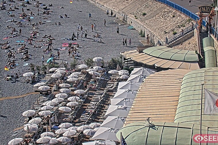 Webcam view of the Castel beach and club on the eastern-most side of the Promenade des Anglais and nestled under the Parc du Chateau, in Nice, France