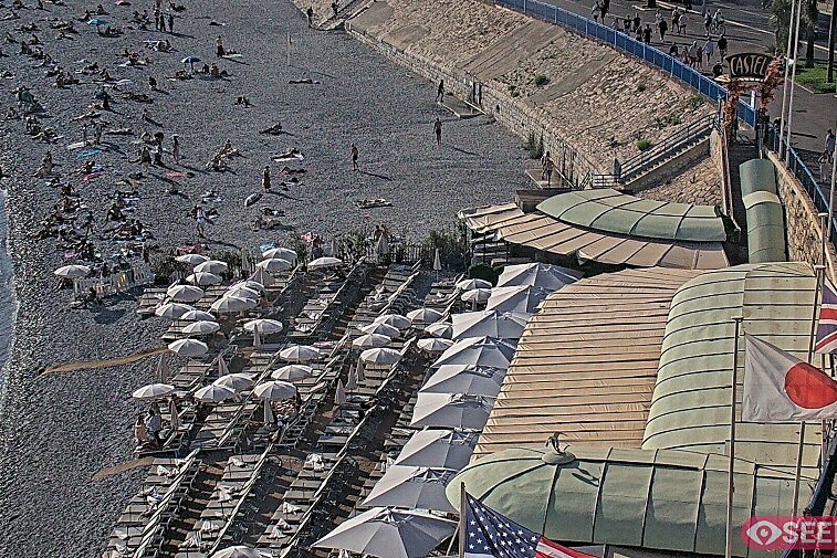 Webcam view of the Castel beach and club on the eastern-most side of the Promenade des Anglais and nestled under the Parc du Chateau, in Nice, France