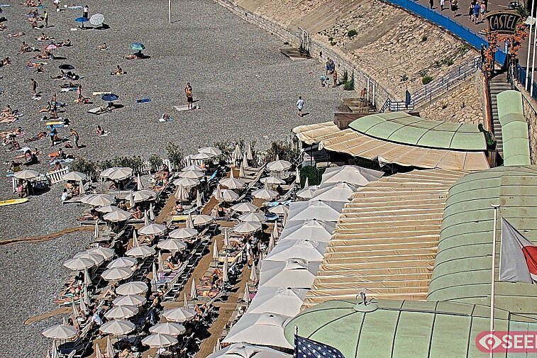 Webcam view of the Castel beach and club on the eastern-most side of the Promenade des Anglais and nestled under the Parc du Chateau, in Nice, France