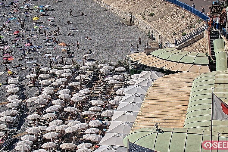 Webcam view of the Castel beach and club on the eastern-most side of the Promenade des Anglais and nestled under the Parc du Chateau, in Nice, France