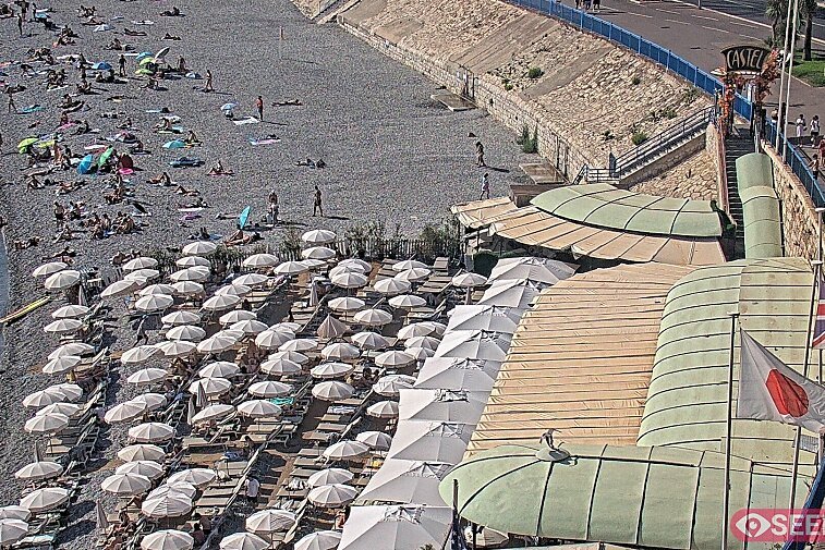 Webcam view of the Castel beach and club on the eastern-most side of the Promenade des Anglais and nestled under the Parc du Chateau, in Nice, France