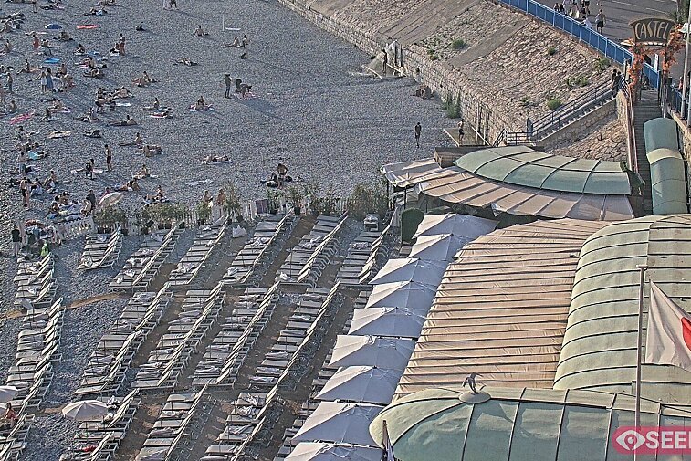 Webcam view of the Castel beach and club on the eastern-most side of the Promenade des Anglais and nestled under the Parc du Chateau, in Nice, France