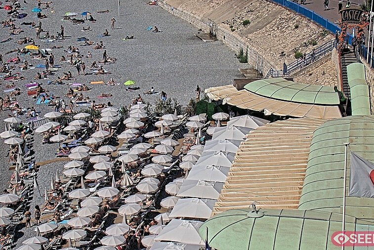 Webcam view of the Castel beach and club on the eastern-most side of the Promenade des Anglais and nestled under the Parc du Chateau, in Nice, France