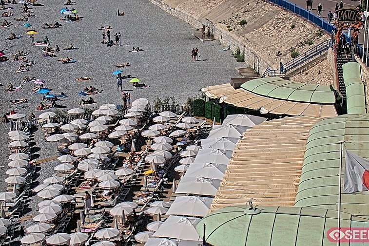Webcam view of the Castel beach and club on the eastern-most side of the Promenade des Anglais and nestled under the Parc du Chateau, in Nice, France