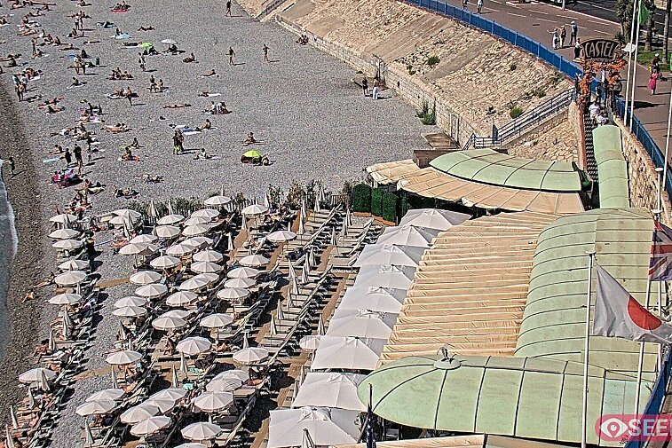 Webcam view of the Castel beach and club on the eastern-most side of the Promenade des Anglais and nestled under the Parc du Chateau, in Nice, France