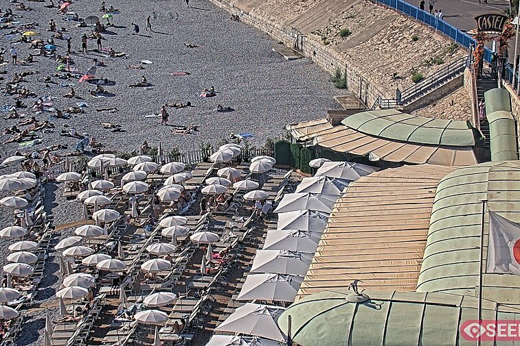Webcam view of the Castel beach and club on the eastern-most side of the Promenade des Anglais and nestled under the Parc du Chateau, in Nice, France