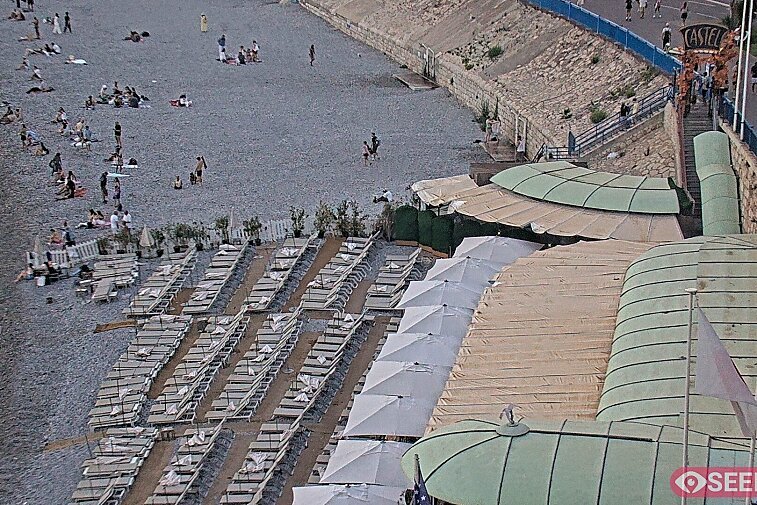 Webcam view of the Castel beach and club on the eastern-most side of the Promenade des Anglais and nestled under the Parc du Chateau, in Nice, France