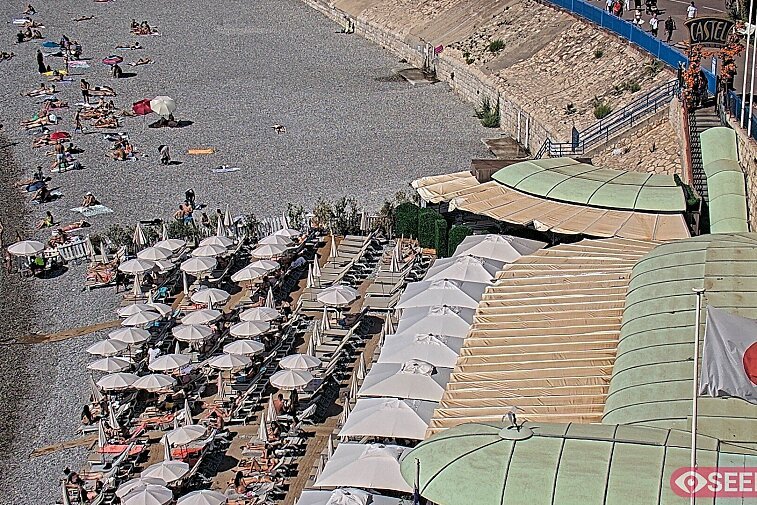 Webcam view of the Castel beach and club on the eastern-most side of the Promenade des Anglais and nestled under the Parc du Chateau, in Nice, France