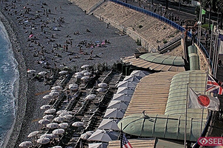 Webcam view of the Castel beach and club on the eastern-most side of the Promenade des Anglais and nestled under the Parc du Chateau, in Nice, France